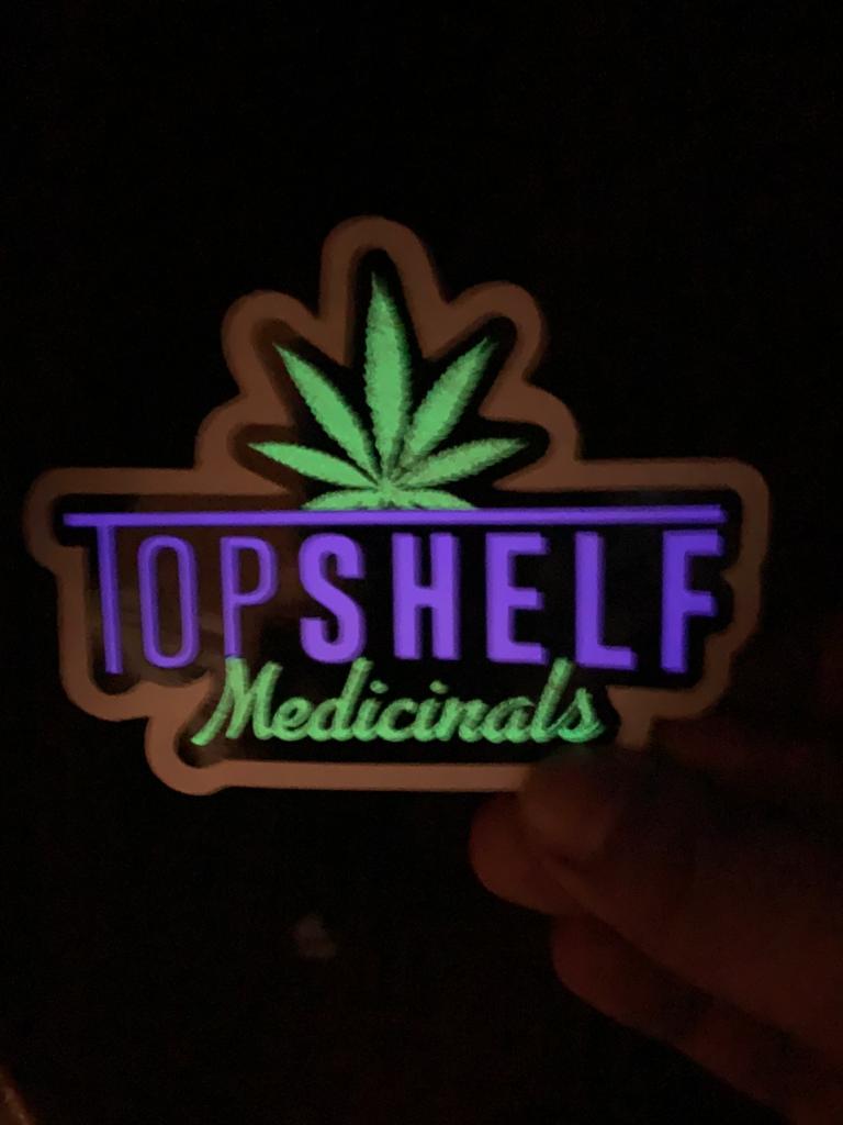 Custom glow-in-the-dark dispensary stickers Top Shelf Medicinals